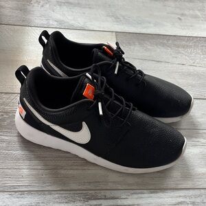 Nike Black Sneakers with White and Orange Details